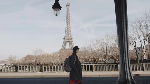 Cinematic side view shot, elegant happy beautiful woman walking along Paris Stock Footage 121469034