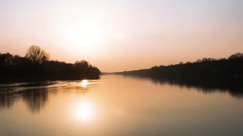 Cinematic slow fly over the river at Sunset time Stock Footage 127537000