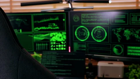 Cinematic slow handheld shot of a hacker-style workspace with code screens. Stock Footage 313113297