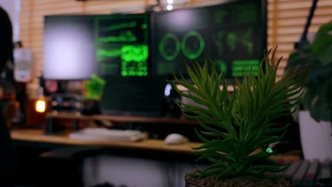 Cinematic slow handheld shot of a hacker-style workspace with code screens. Stock Footage 313113582