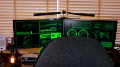 Cinematic slow handheld shot of a hacker-style workspace with code screens. Stock Footage 313113649