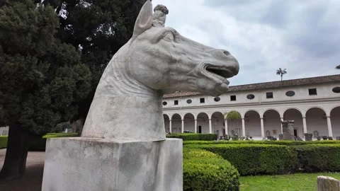 Cinematic Slow Motion Of Classical Stone Horse Head In Lush Garden Stock Footage 332873223