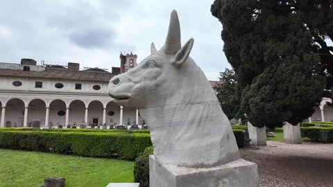 Cinematic Slow Motion Of Classical Stone Bull Head In Lush Garden Stock-Footage 332873268