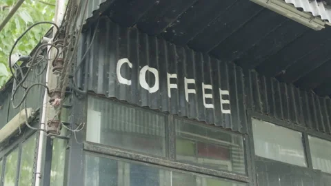 Cinematic slow motion close-up of "COFFEE" sign on metallic surface Vídeo Stock 337382935