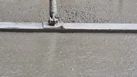 Cinematic Slow Motion Close-up of Trowel Leveling Fresh Concrete - 4K Stock Footage 331702249