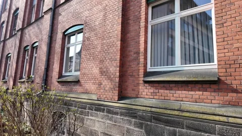 Cinematic slow motion detail of a classic brick house facade in Rome Stock Footage 333920249