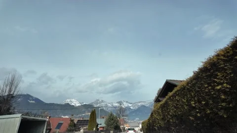 Cinematic Slow Motion Drive Through Snowy Styrian Village, Alpine POV. Video stock 328695044