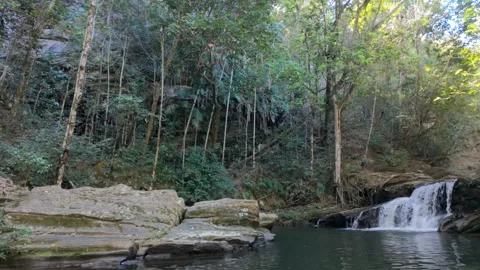 Cinematic slow motion of small waterfall in tropical forest Stock Footage 339604526
