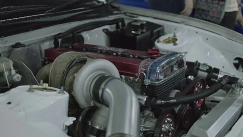 Cinematic slow pan of modified race car engine bay with turbocharger Stock Footage 345658858