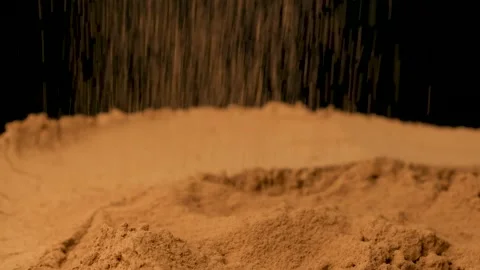Cinematic sprinkle of raw cocoa powder on black background Stock Footage 336781680