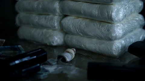 Cinematic Stash Of Cocaine Bricks With Guns And Money, Drugs 4K Stock Footage