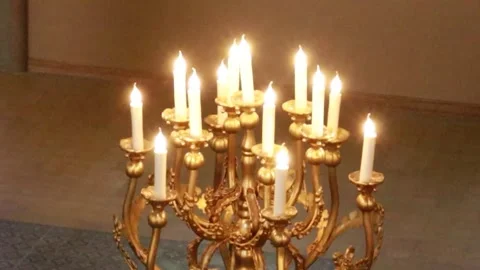 Cinematic Static Shot of a Glowing Floor Candelabra in Synagogue 動画素材 331137178