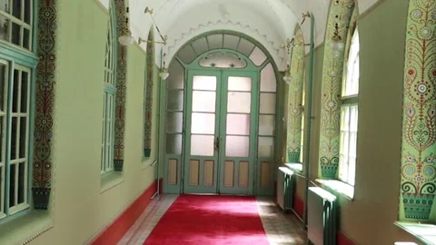 Cinematic Static Shot of Historic Corridor and Wooden Doors 库存影片 330369561