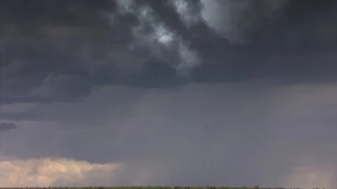 Cinematic storm clouds with lightning strikes reflecting Stock Footage 105798260