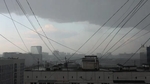 Cinematic storm clouds moving over city as heavy rain falls Stock Footage 340873764