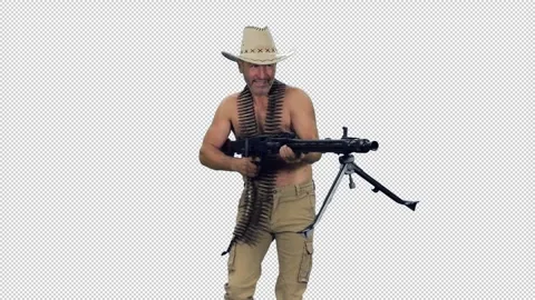 Cinematic style of daring bare-chested man walking and shooting a machine gun Video stock 306025889