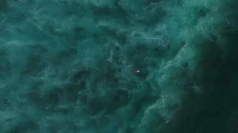 Cinematic Style Flyover Surfer Paddling Uluwatu Water 4K Vidéo 341004697
