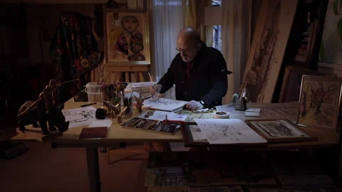 Cinematic style with smooth camera movement approaching of an artist working  Video stock 152344791