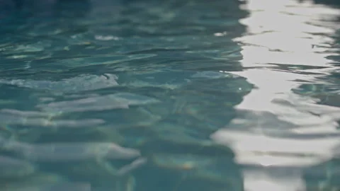 Cinematic Sun Beams on a Pool Surface Vídeo Stock 340570761