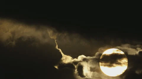 Cinematic Sun movement close up through dark storm ominous clouds Stock Footage 49965110