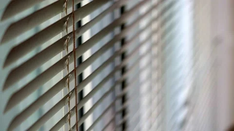 Cinematic sunlight through the blinds. Sun flare seen through window. Stock Footage 145736061