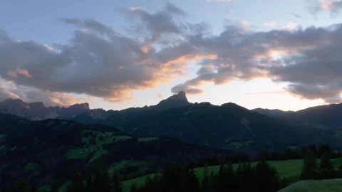 Cinematic sunset aerial orbit view of the Sass de Putia in cloud-kissed Stock Footage 273658871