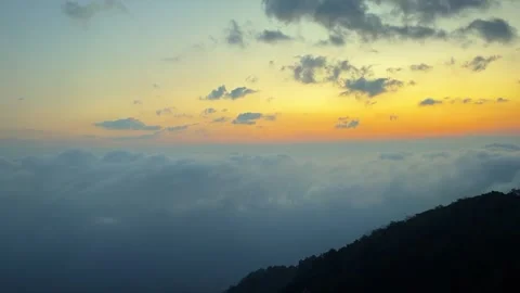 Cinematic Sunset Afterglow Over Rolling Sea of Clouds China Stock Footage 334705652