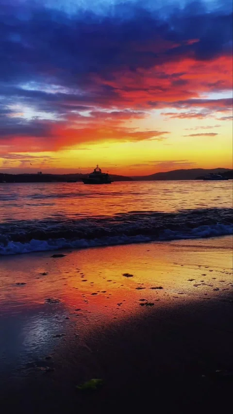 Cinematic Sunset at Beach with Dramatic Colorful Sky and Sea Waves Silhouette Stock Footage 331899831