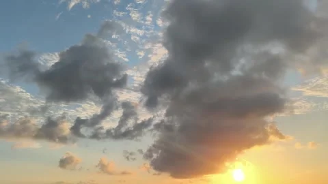 Cinematic Sunset with Dramatic Clouds and Golden Sunlight Stock Footage 340465215