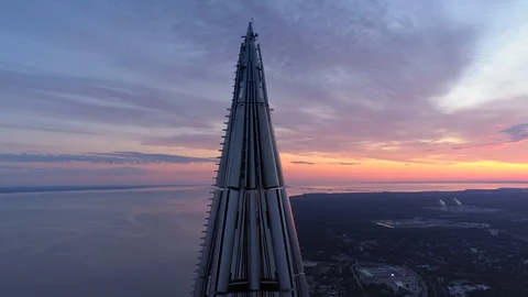 Cinematic sunset Flight epic spire modern Petersburg skyscraper cityscape. Bay  Stock Footage 128621111