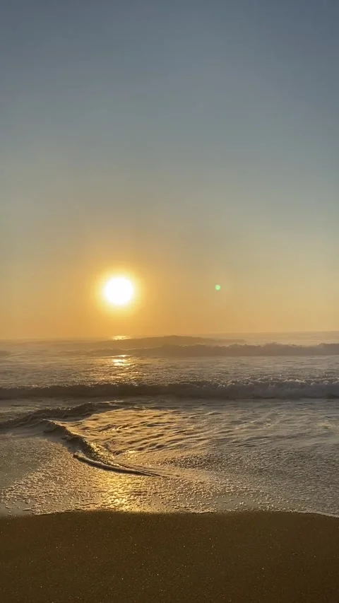 Cinematic sunset on the ocean. Sunset on the beach in Portugal. Golden sunset on Stock Footage 301142352