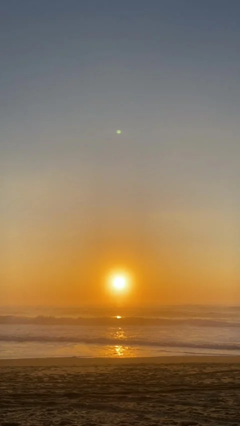 Cinematic sunset on the ocean. Sunset on the beach in Portugal. Golden sunset on Stock Footage 312803816