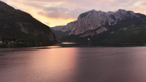 Cinematic sunset over alpine lake and mountains in Austria Stock Footage 335362053