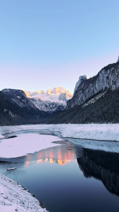 Cinematic sunset over Alpine lake in winter mountains. Winter mountain Stock Footage 344886207