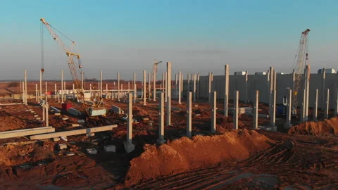 Cinematic sunset view of modern construction site. Building industrial area of Stock Footage 163226121