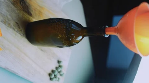 Cinematic tabletop study: collecting homemade broth in a container Stock Footage 342172642