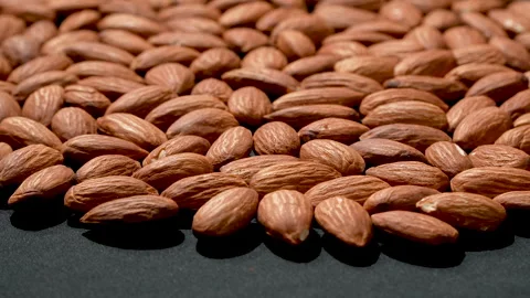Cinematic Tilted Raw Almonds Macro With Dramatic Lighting 4K 스톡 동영상 332846002
