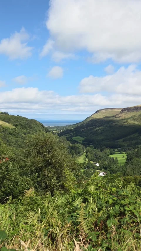 Cinematic time lapse: cloud shadows glide over Glenariff’s lush hills Stock-Footage 314908285