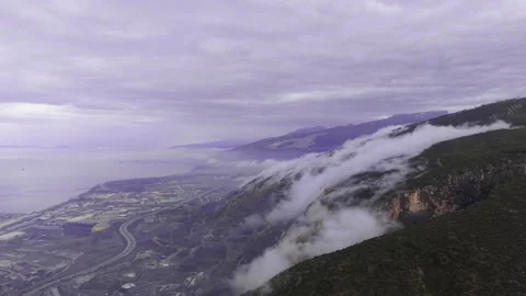 Cinematic Time-Lapse of Cloud Waterfall Cascading Down Mountains l 4K Stock Footage 332000187
