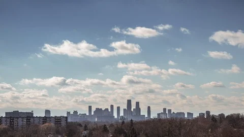 Cinematic time lapse with cloudy sky and the city of Mississauga in the horizon. Stock Footage 99990321