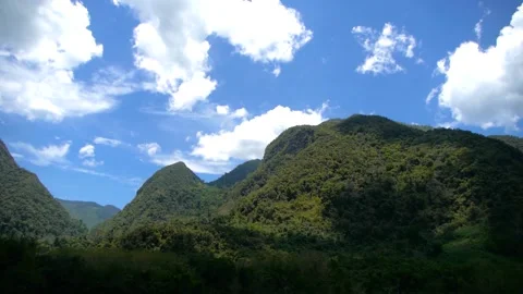 Cinematic time lapse of passing clouds over Mountains Stock Footage 232594622
