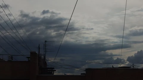 Cinematic time lapse  sky looming over an urban landscape 스톡 동영상 340066873