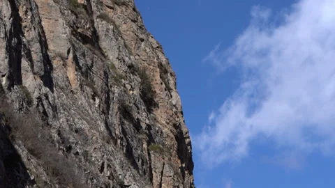 Cinematic Timelapse of Clouds Moving Across Mountain Ridge Video stock 318902482