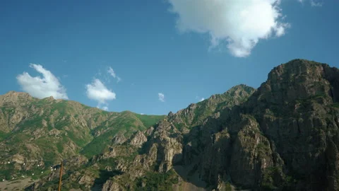 Cinematic timelapse of mountains with clouds sunny day cliffs Stock Footage 199945448