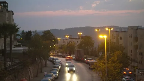 Cinematic timelapse of a sunset turning into night over a Jerusalem street with Stock Footage 301599294