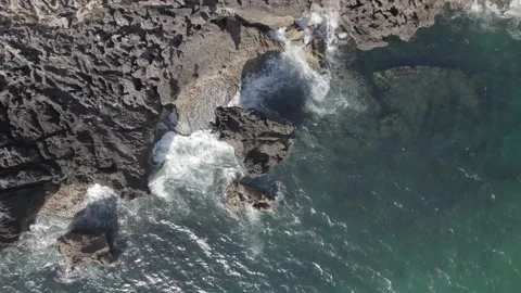 Cinematic top down ascending spirral towards rocky cliff near Cascais, Portugal Stock Footage 194767598