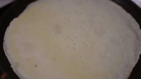 A cinematic, top-down close-up of a thin pancake Stock Footage 329318206