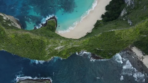 Cinematic Top-Down Drone View of Kelingking Beach Cliffs and Turquoise Ocean, Nu Stock Footage 261975719