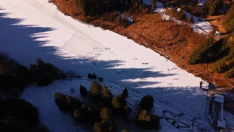 Cinematic top-down drone view of skaters on Grubsee lake. The frozen water is Stock Footage 325860917