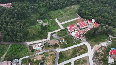 Cinematic top-down drone view of a developing residential layout in Yercaud Stock Footage 340383066